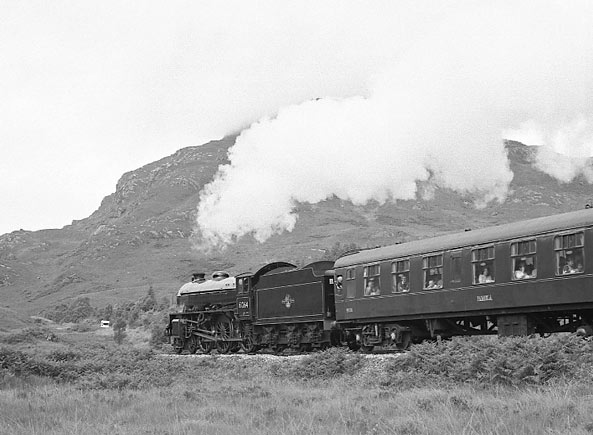 LNER B1 4-6-0 61264 climbs away from Glenfinnan and on towards Mallaig with 'The Jacobite'. July 9 2003