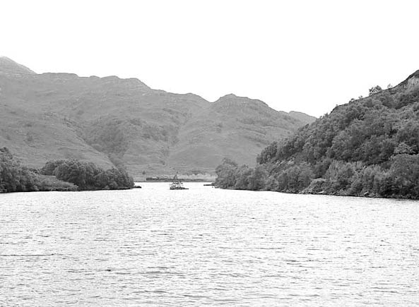 B1 61264 brews up running alongside Loch Eilt before the tough climb away from the loch. July 8 2003