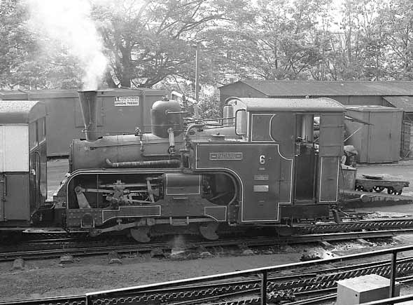 No.6 Padarn alongside the coal stage and water column at Llanberis. This loco sports an early Nigel Day exhaust system. The shape of the chimney is the give away. July 11 2003