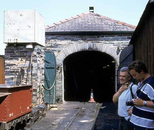 This shed is the original TR depot at Pendre and is still in use today. On the right (from the left) are Chris Parrott and Jeremy Phelan. July 14 2003
