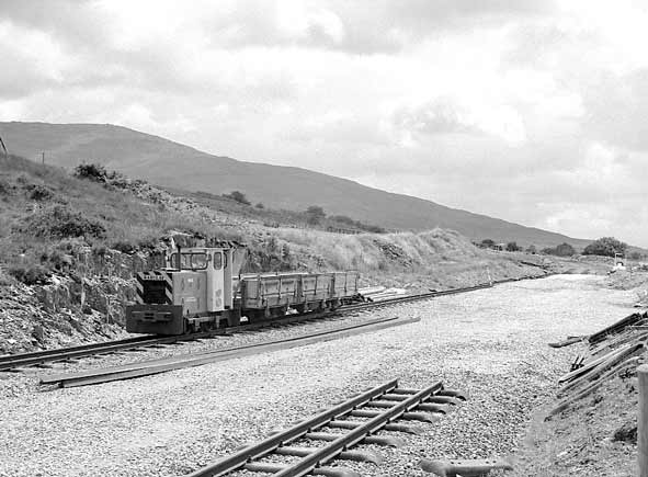 At Rhyd Ddu we found some trackwork was still outstanding. Here WHR (1964) Company 4 wheel Barclay diesel 'Taxi 2' was seen on a works train. July 11 2003