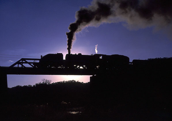 15th Class 4-6-4+4-6-4 406 stands on the river bridge at Lukosi. May 13 1997