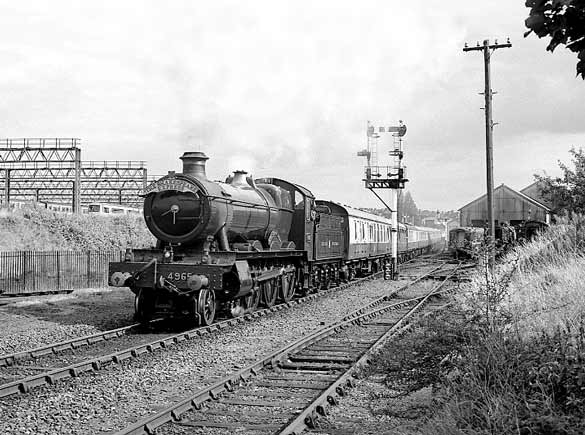 4965 Rood Ashton Hall departs from Tyseley Locomotive Works for Birmingham Snow Hill. The loco and train were running empty in readiness to form the afternoon 'The Shakespeare Express' working to Stratford Upon Avon and return. August 31 2003