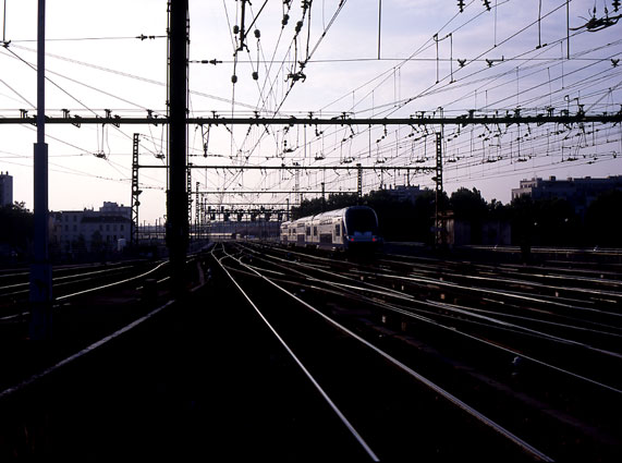 An electric multiple unit heads south away from Lyon Perrache. 