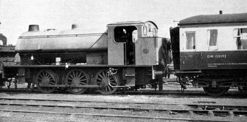Hunslet 0-6-0 "Austerity" No.3883, painted grey and fitted with the new underfeed stoker and gas producer system, on test and coupled to Western Region dynamometer car at Oxford motive power depot on April 26 1963. © David A. Anderson Hunslet 0-6-0 "Austerity" No.3883, painted grey and fitted with the new underfeed stoker and gas producer system, on test and coupled to Western Region dynamometer car at Oxford motive power depot on April 26 1963. © David A. Anderson