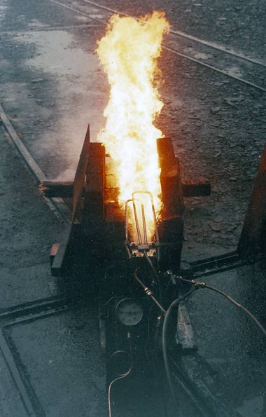 One of the burner experiments. Note the loops of pipework towards the rear of the flames. These superheat the atomising steam. Superheat is an important improvement for all oil firing systems. © Nigel A. H. Day