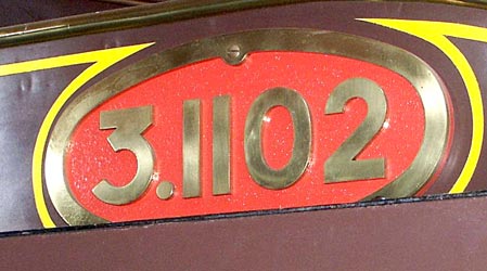3.1102 is displayed in the very attractive Nord Railway chocolate brown colour scheme with a number of brass plates such as this one. October 9 2003