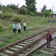 DSC3122  Whilst the train is run for tourists on the downhill leg a few locals with a heavu barrel of something were dropped off at Garliște. : Romania